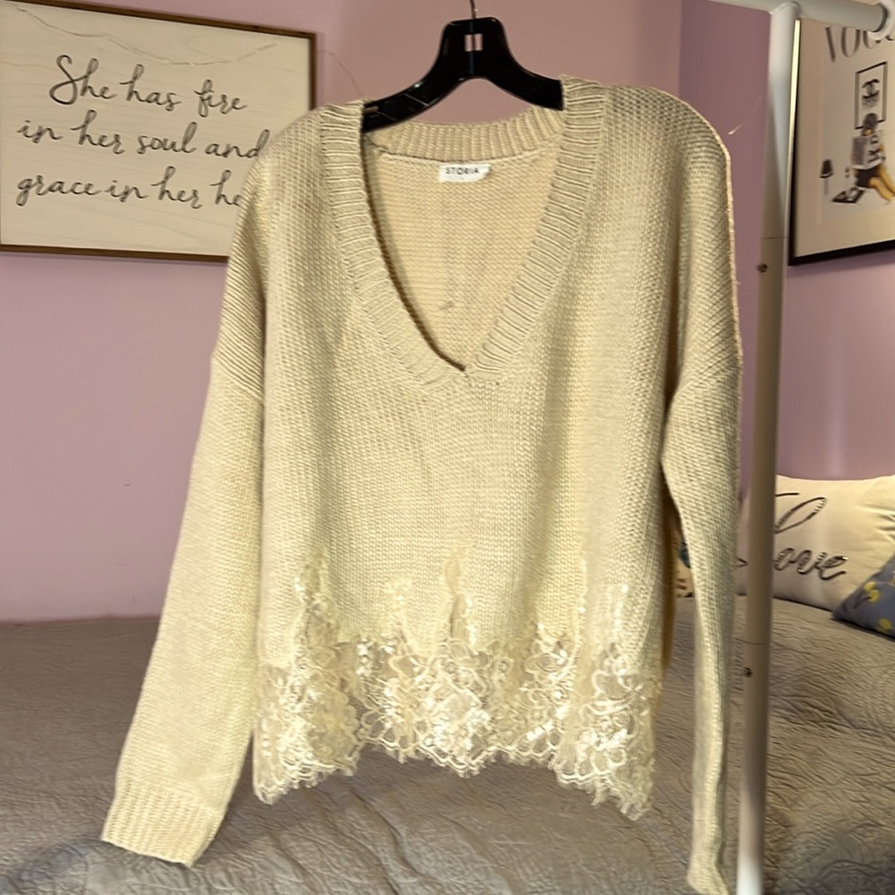Storia v-neck sweater with lace trim on bottom. EUC
